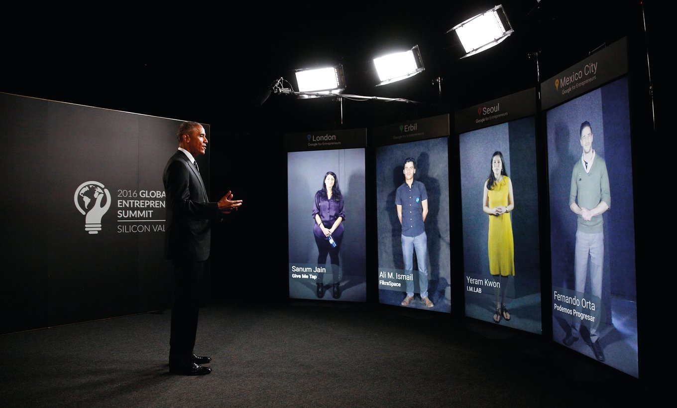 President Obama speaking through portal screens