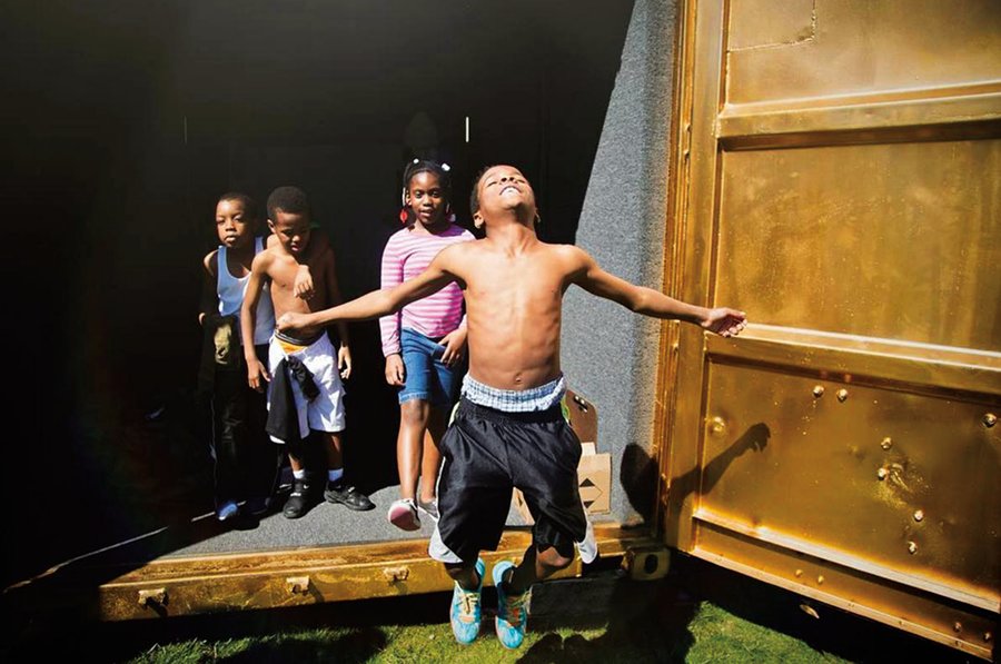 kids playing in portal container in Milwaukee